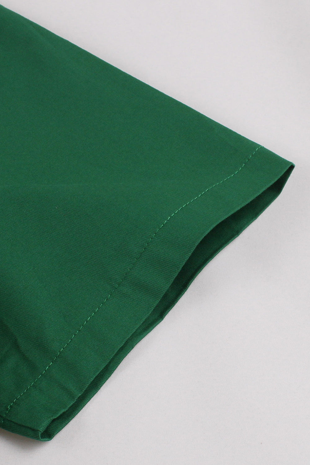 Vestido verde escuro babado assimétrico dos anos 1950 com laços