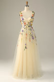 Vestido de baile champanhe com flores