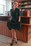 Vestido de 1950 vintage verde escuro com mangas