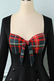 Vestido xadrez de 1950 com mangas compridas