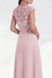 Vestido longo de mãe da noiva verde floral em linha A, decote redondo, com aplicação e mangas altas