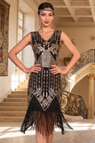 Vestido de lantejoulas pretas douradas com decote em V e franjas