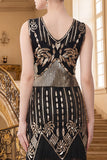 Vestido de lantejoulas pretas douradas com decote em V e franjas
