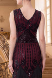 Vestido de lantejoulas pretas douradas com decote em V e franjas