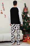 Conjunto de pijamas familiares pretos de manga comprida com estampado de Natal a condizer