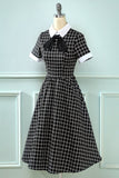 Vestido vintage xadrez de 1950 com arco