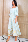 Um vestido de mãe verde claro de pescoço quadrado quadrado