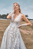 Uma linha de tule vestido de noiva de marfim com apliques