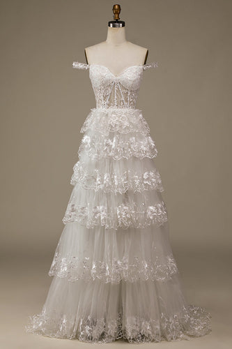 Vestido de noiva de renda em camadas branco brilhante com fenda