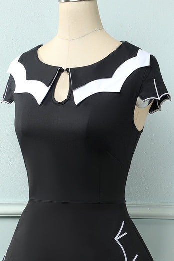 Vestido preto de balanço de cabo de morcego dos anos 50